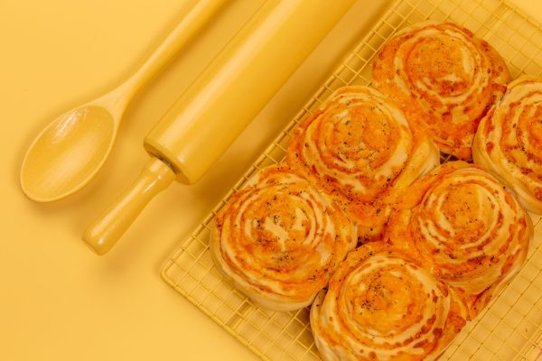 Layers of mouth-watering, rich cheddar cheese, savory garlic, and spices, baked to perfection for the ultimate tear-apart treat.