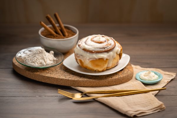 Baked to perfection with cinnamon and brown sugar layered through each wrap of our dough, this treat is topped off with our delectable cream cheese frosting. Available in mini size too!